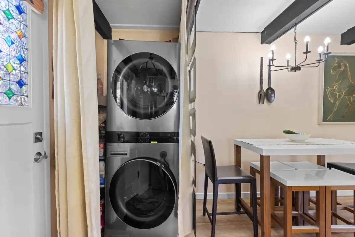 Stacked washer and dryer beside the dining area, Cortina Chalet