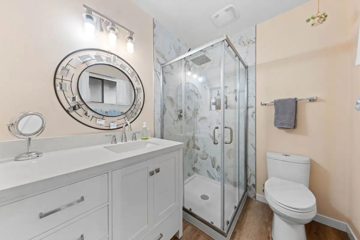 Bathroom with a glass shower and white vanity, Cortina Chalet