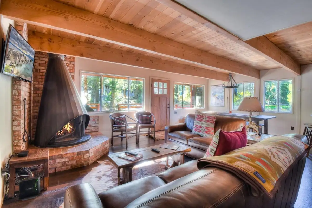 Stay cozy and gather around with some hot chocolate by the wood fireplace, Enchanting Chamberlands Cabin
