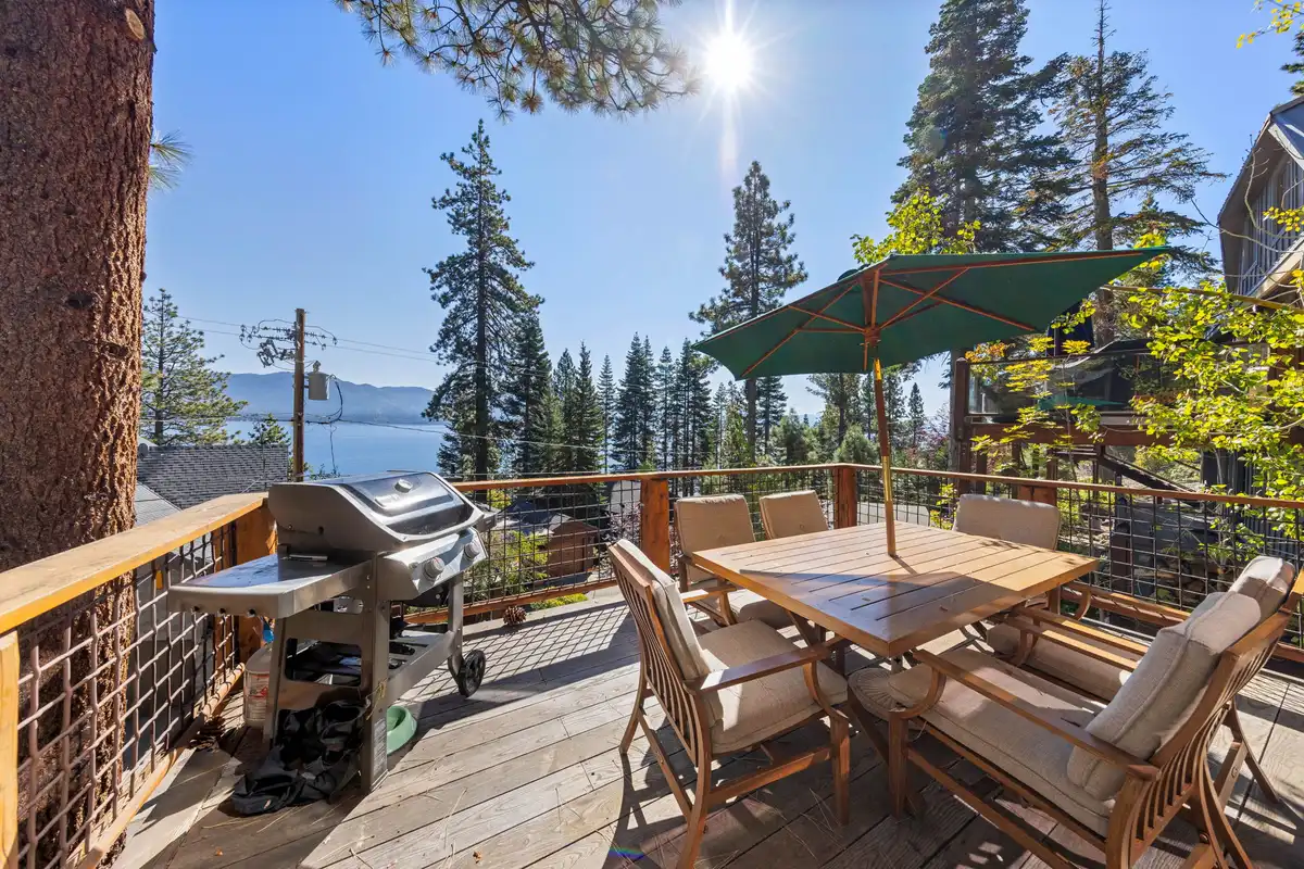 Deck with dining set and grill with Lake Tahoe visible, Livin' on the Edge