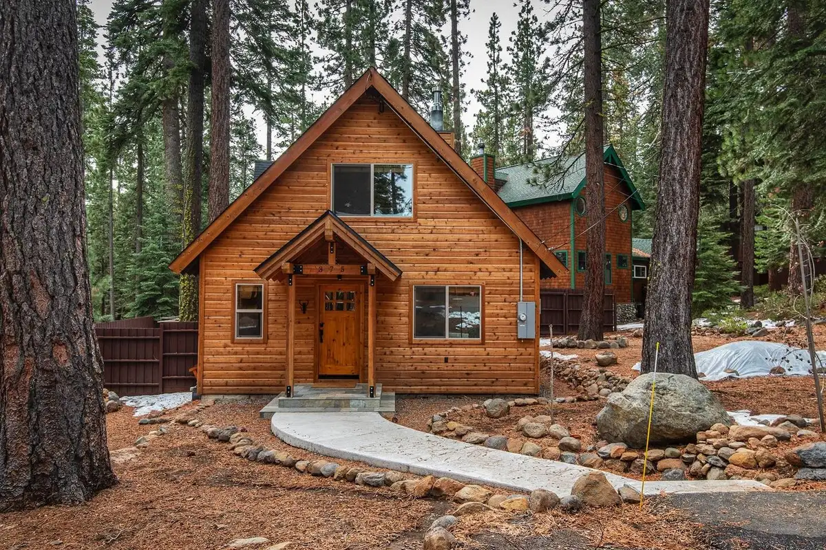 Wood cabin front with a gabled porch and walkway, Restful North Ridge