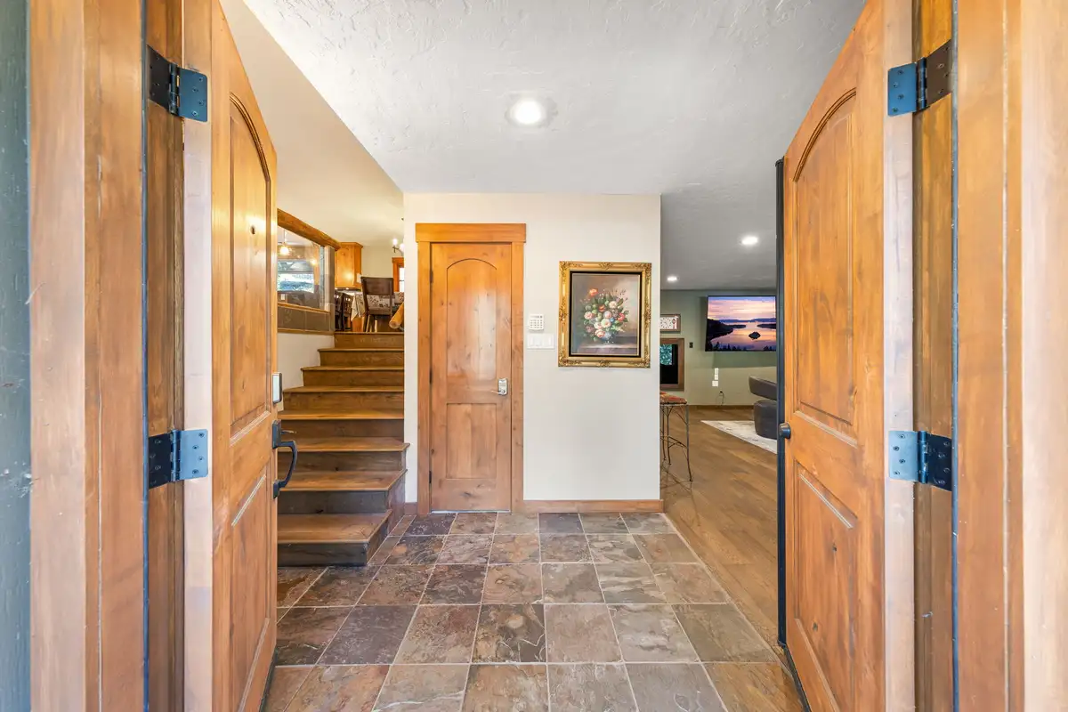 Entryway with slate tile floor and stairs leading up, Tranquil Stay
