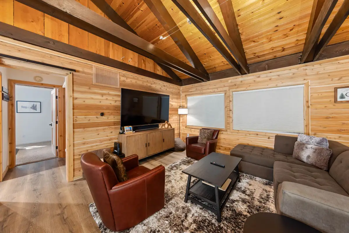 Living room with sectional sofa and exposed ceiling beams, Updated West Shore Cabin 1 mile to Chambers Beach