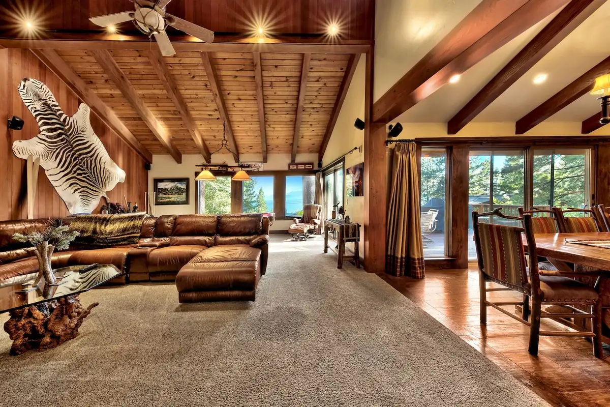 Great room with wood ceiling, leather sectional and dining table, Mammoth Haven Retreat