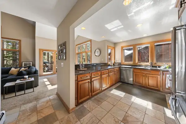Kitchen with wood cabinets and tile floor, Elevated Tahoe Escape