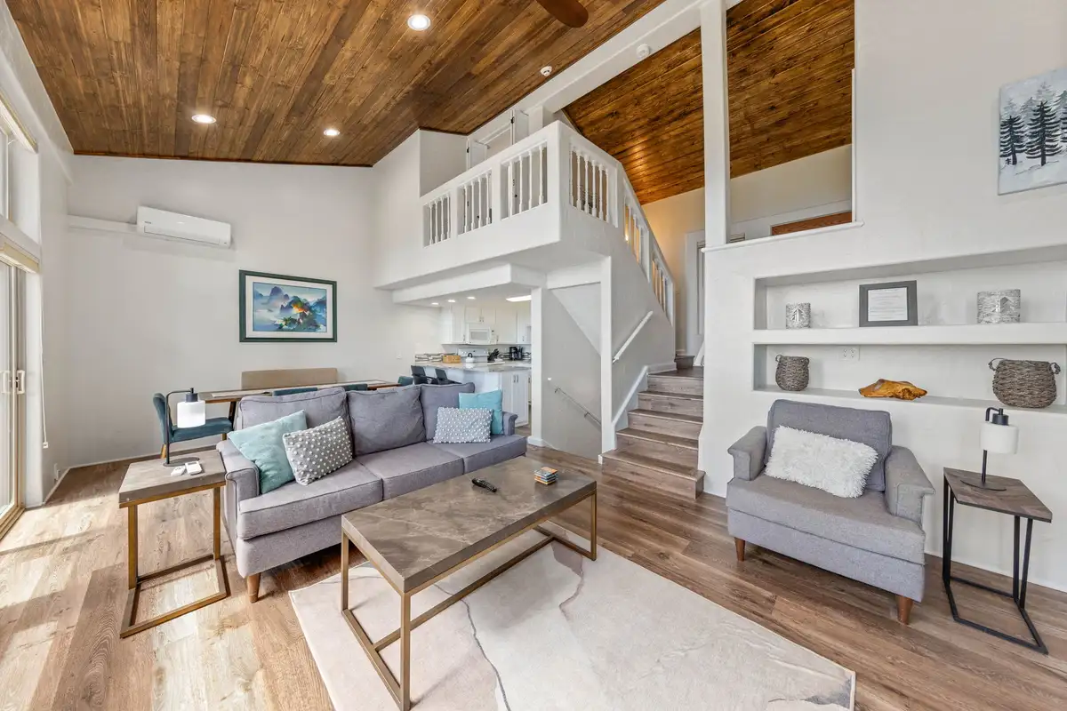 Living room with sofa and stairs to an upper loft, Lakeview Haven in Incline Village