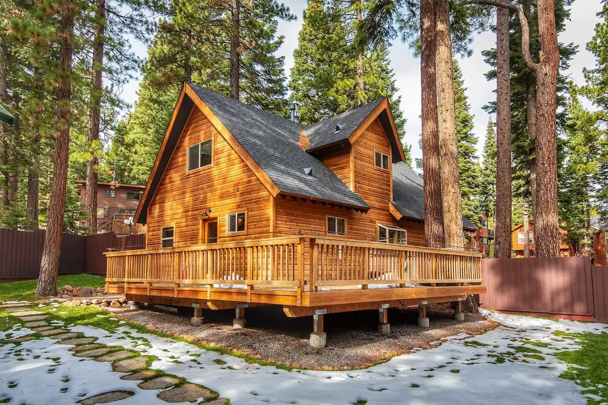 Wood cabin with a wraparound deck among pines, Restful North Ridge