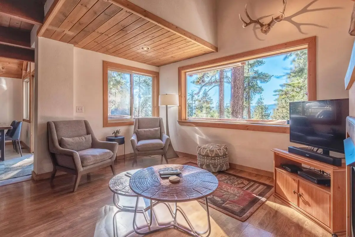 Sitting area with chairs and a window to the trees, Lakeview Serenity Cottage