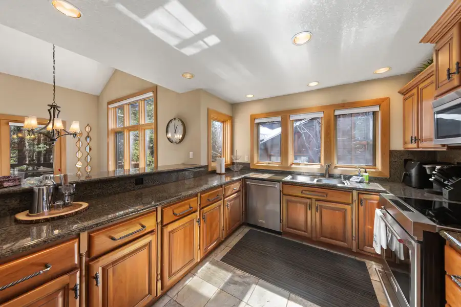 Kitchen with granite counters and wood cabinets, Elevated Tahoe Escape
