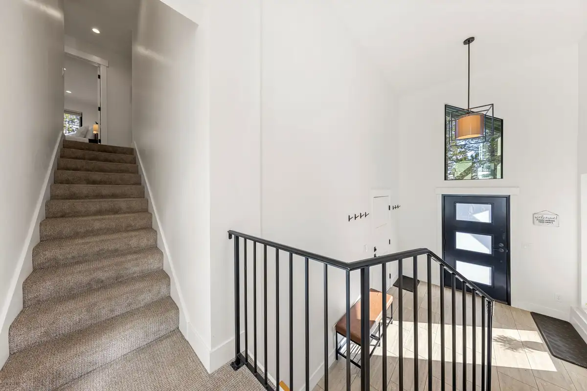 Entry hallway with stairs and a modern front door, Incline Lakehouse Lookout