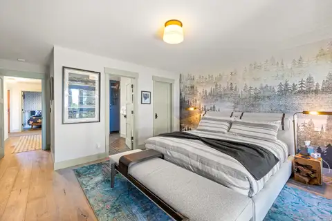 Bedroom with a bed and forest mural wall, Lakeside Luxe Retreat