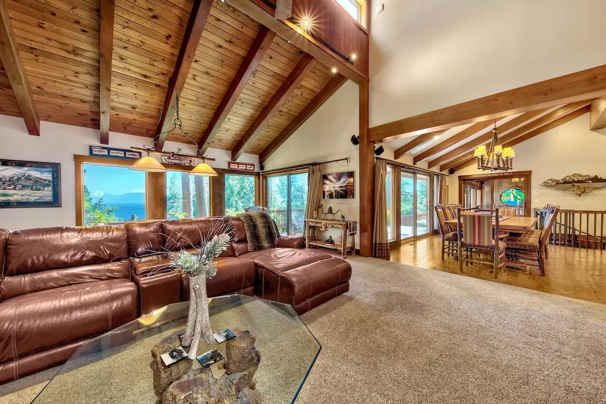 Leather sectional with Lake Tahoe visible through the windows, Mammoth Haven Retreat