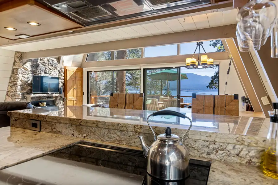 Kitchen counter with Lake Tahoe visible through A-frame windows, Livin' on the Edge
