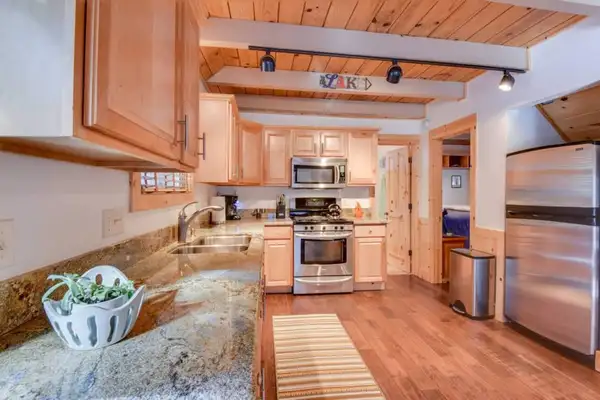 Kitchen with granite counters and stainless appliances, Tranquil Trails Cabin