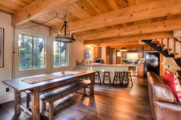 Long farmhouse dining table with benches and kitchen bar, Enchanting Chamberlands Cabin