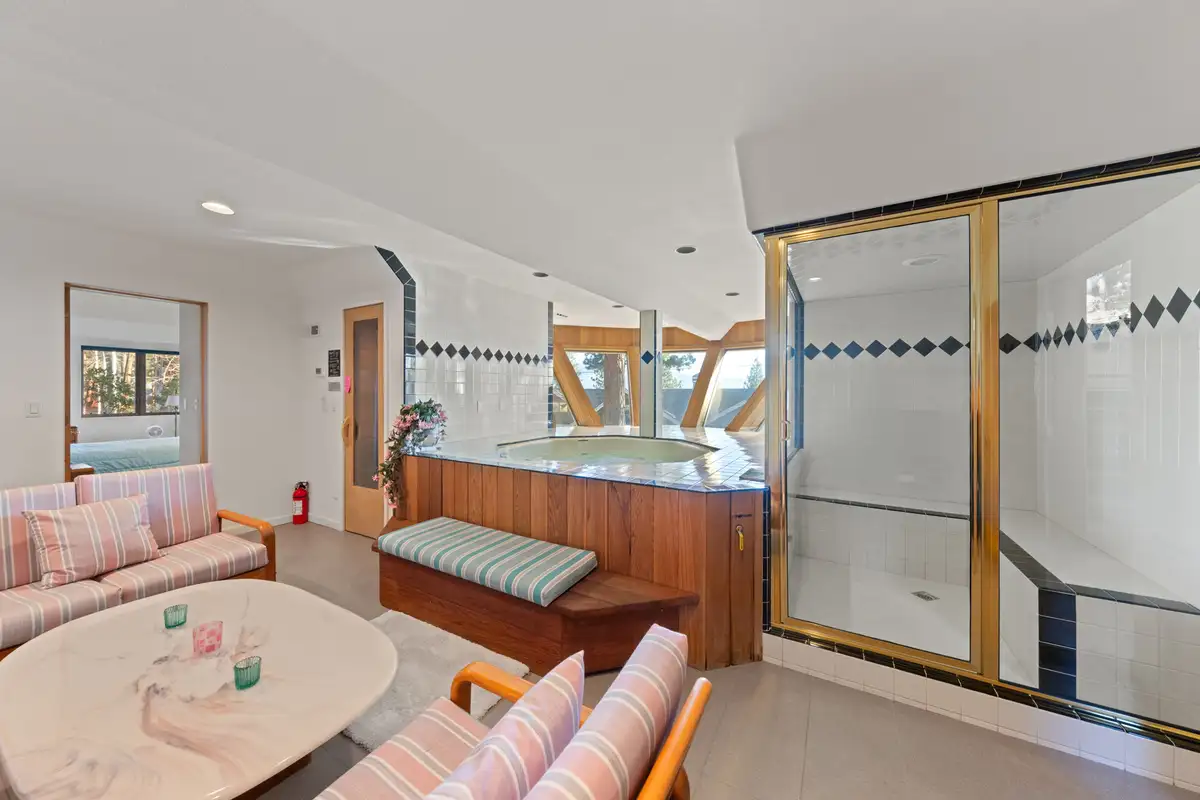 Lounge with an indoor hot tub and glass shower, 90s Tahoe Time Capsule