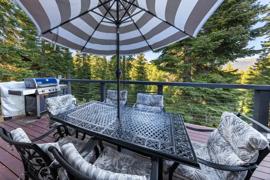 Deck with striped umbrella, dining set and grill, Lakeview Grandeur