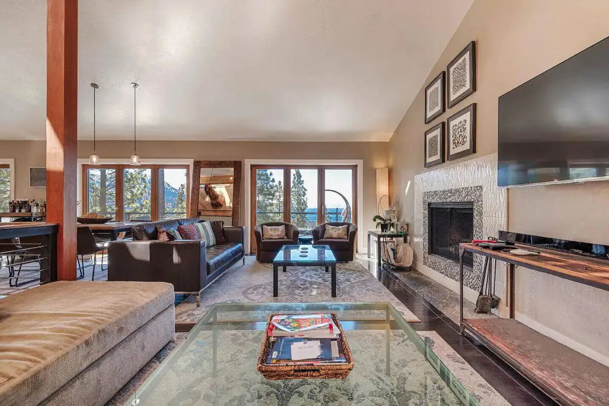 Living room with a fireplace, wall TV and glass coffee table, Skylake Serenity Retreat