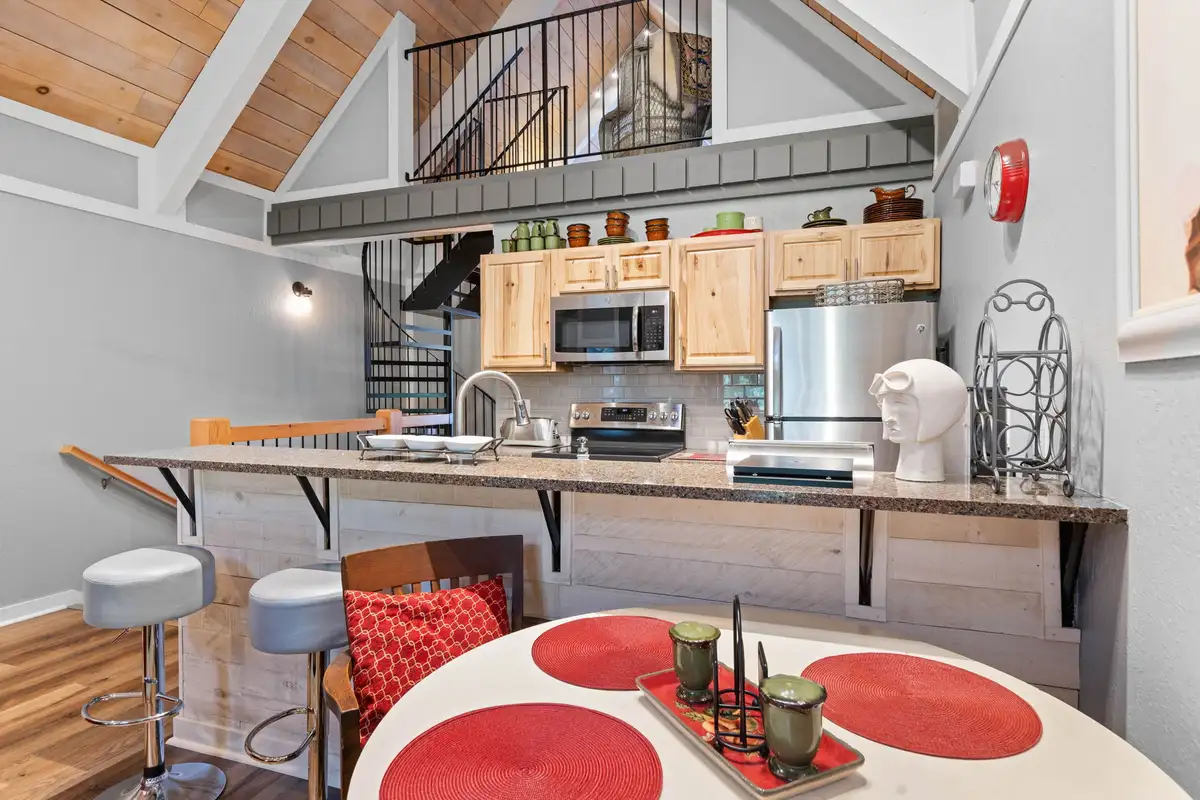 Kitchen breakfast bar with spiral stairs to the loft, Tahoe Peaks & Shores Retreat