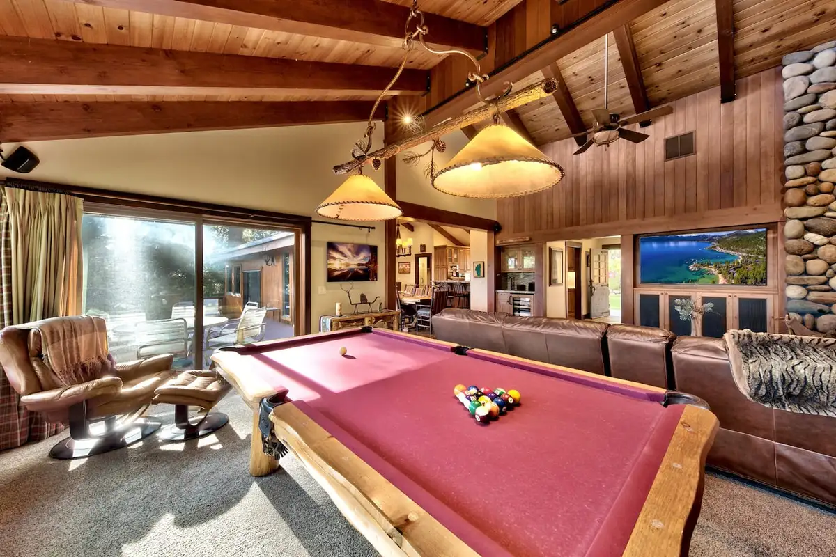 Pool table with leather seating in a wood-beamed room, Mammoth Haven Retreat
