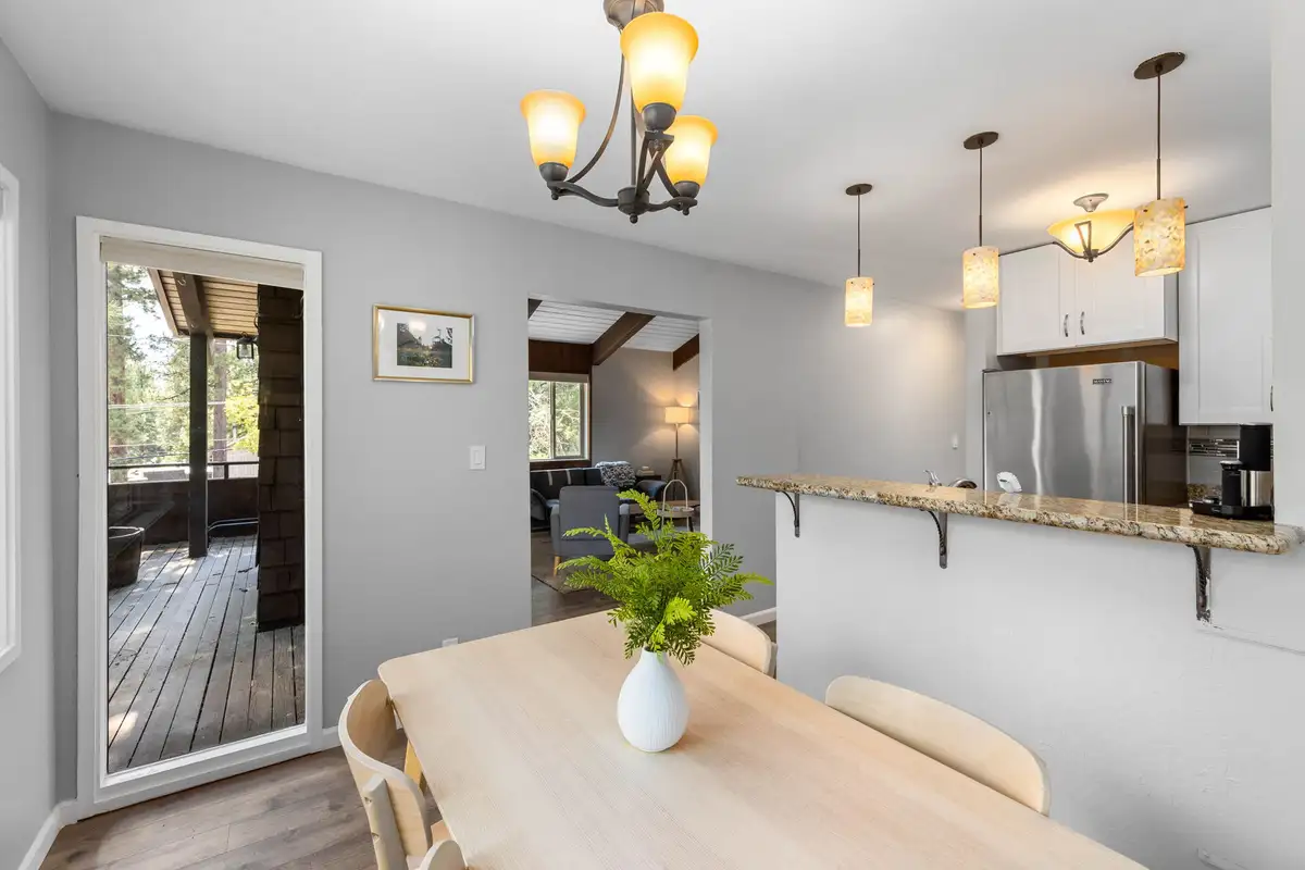 Dining table near the kitchen and a door to the deck, Incline Tranquil Loft