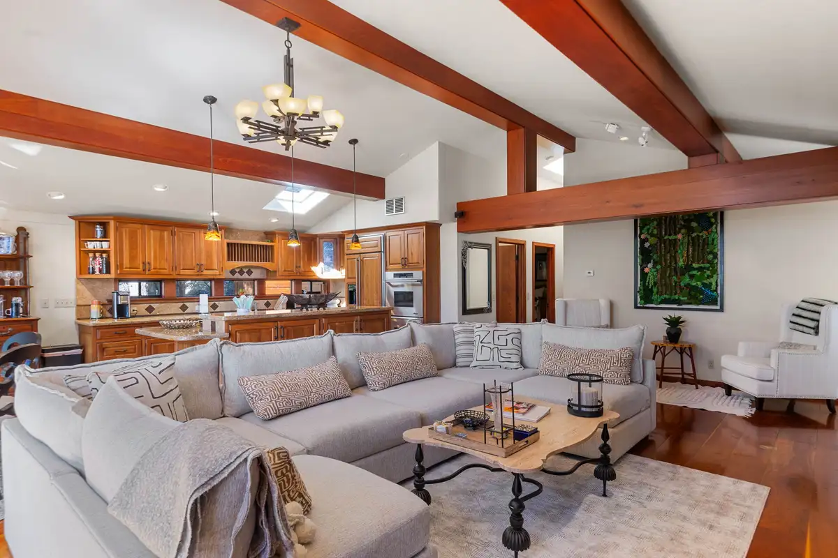 Living room with white sectional and kitchen beyond, Incline Lakeside Haven