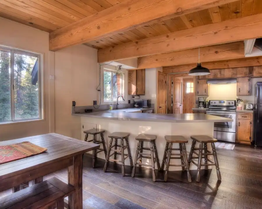 The kitchen is equipped with a drip coffee top, electric stovetop, Enchanting Chamberlands Cabin, an MG home in Tahoma