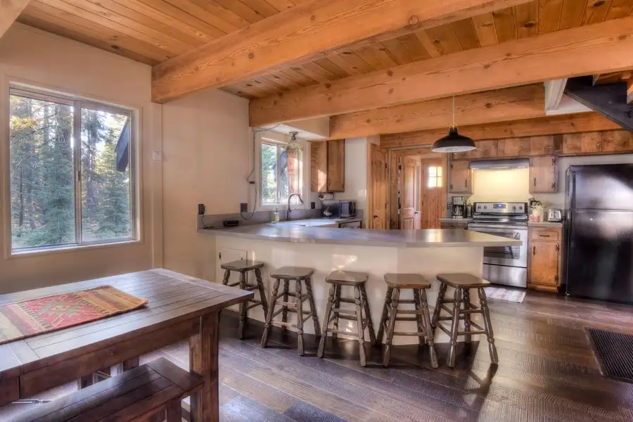 The kitchen is equipped with a drip coffee top, electric stovetop, Enchanting Chamberlands Cabin