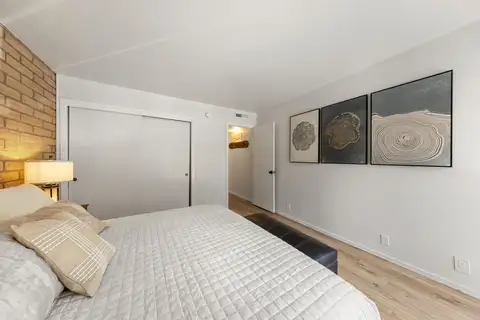 King bedroom with spacious closet and modern artwork, Treetop on Country Club