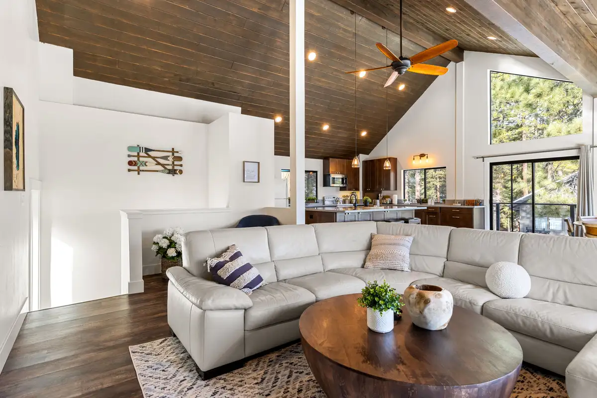 Living room with white sectional and vaulted wood ceiling, Incline Lakehouse Lookout