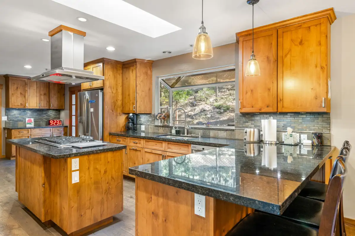 Kitchen with granite counters, island and breakfast bar, Tranquil Stay