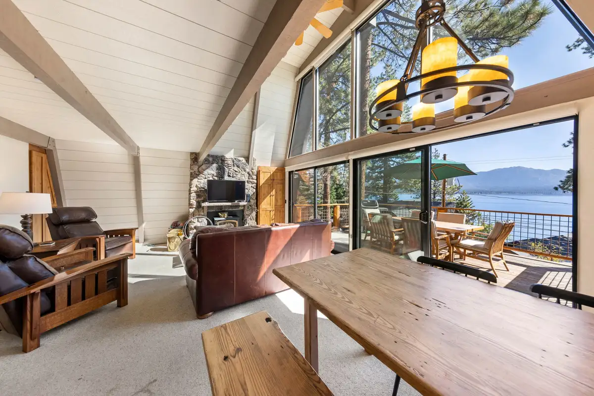Dining table with Lake Tahoe visible through tall windows, Livin' on the Edge