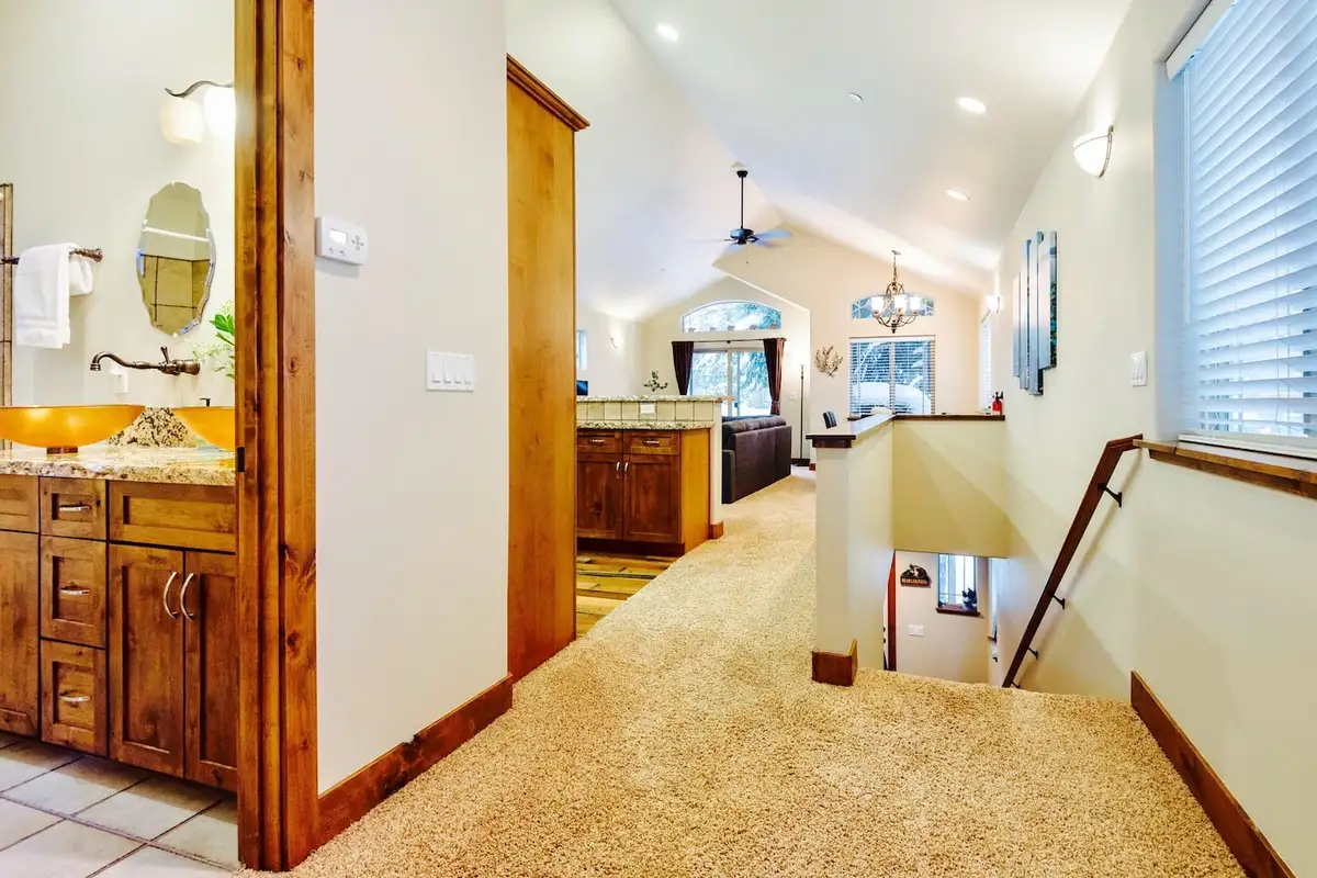 Upstairs hallway with vanity nook opening to the living area, Trout and About