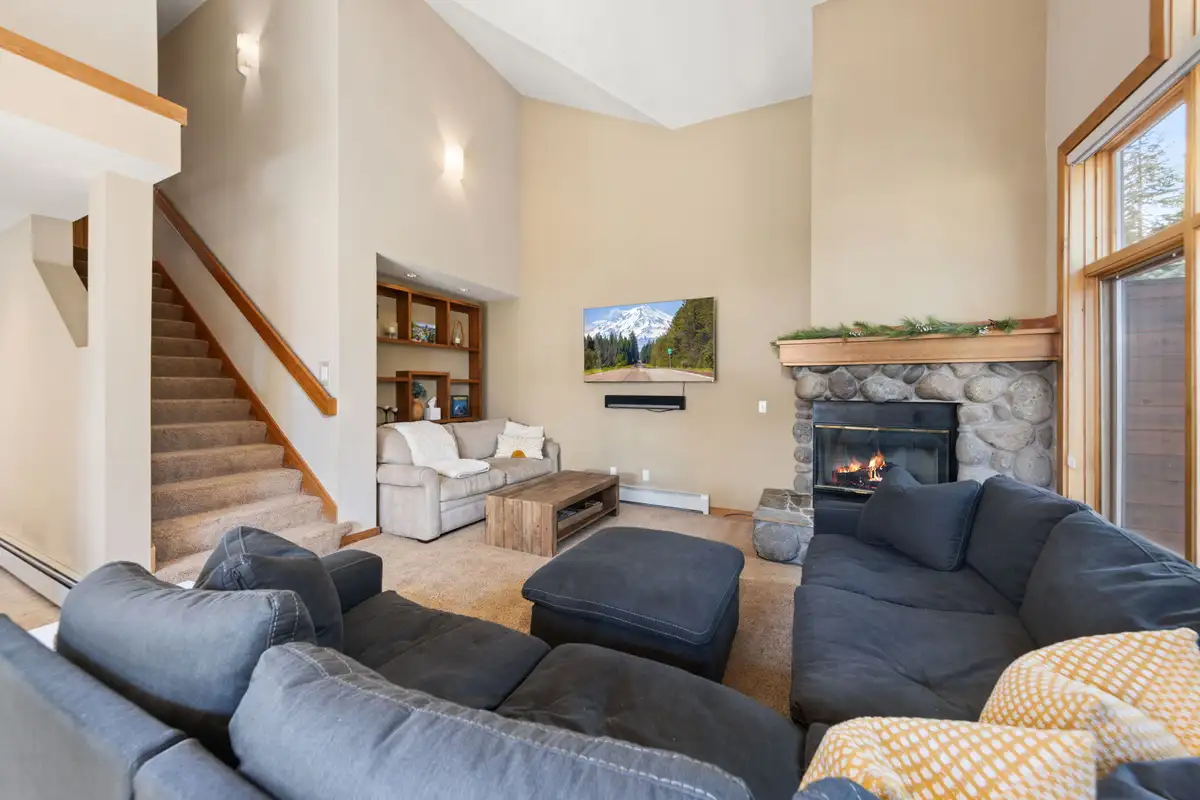 Living room with sectional and stone fireplace, Elevated Tahoe Escape