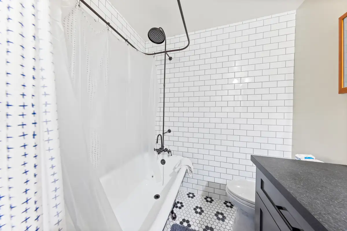 Bathroom with subway tile tub shower, Lakeside Luxe Retreat