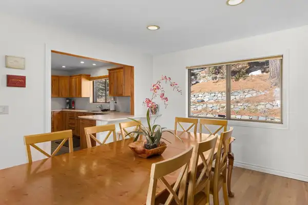 Dining table with chairs and a pass-through to the kitchen, Tranquil Alpine Bliss
