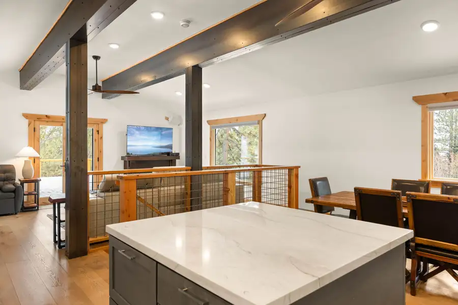 Kitchen island with dining table and living room beyond, Sugar Pine Tahoe Lodge