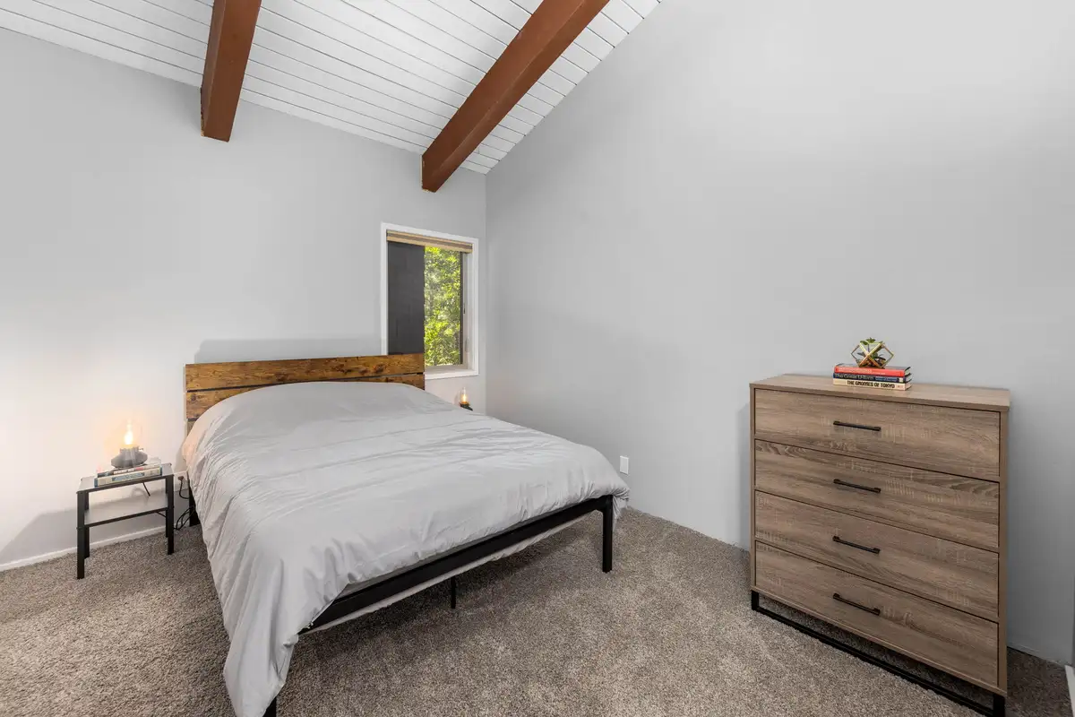 Bedroom with a bed and wood dresser, Incline Tranquil Loft