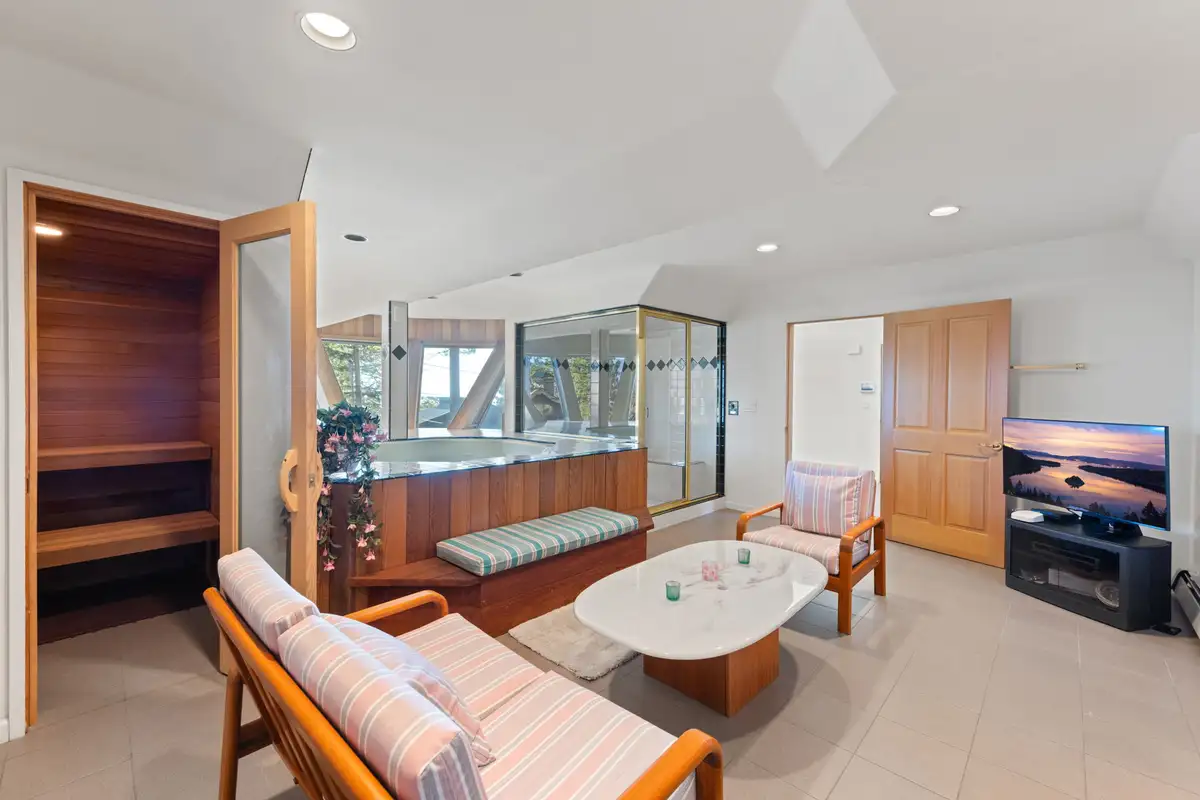 Lounge with sofa, TV and sauna door, 90s Tahoe Time Capsule