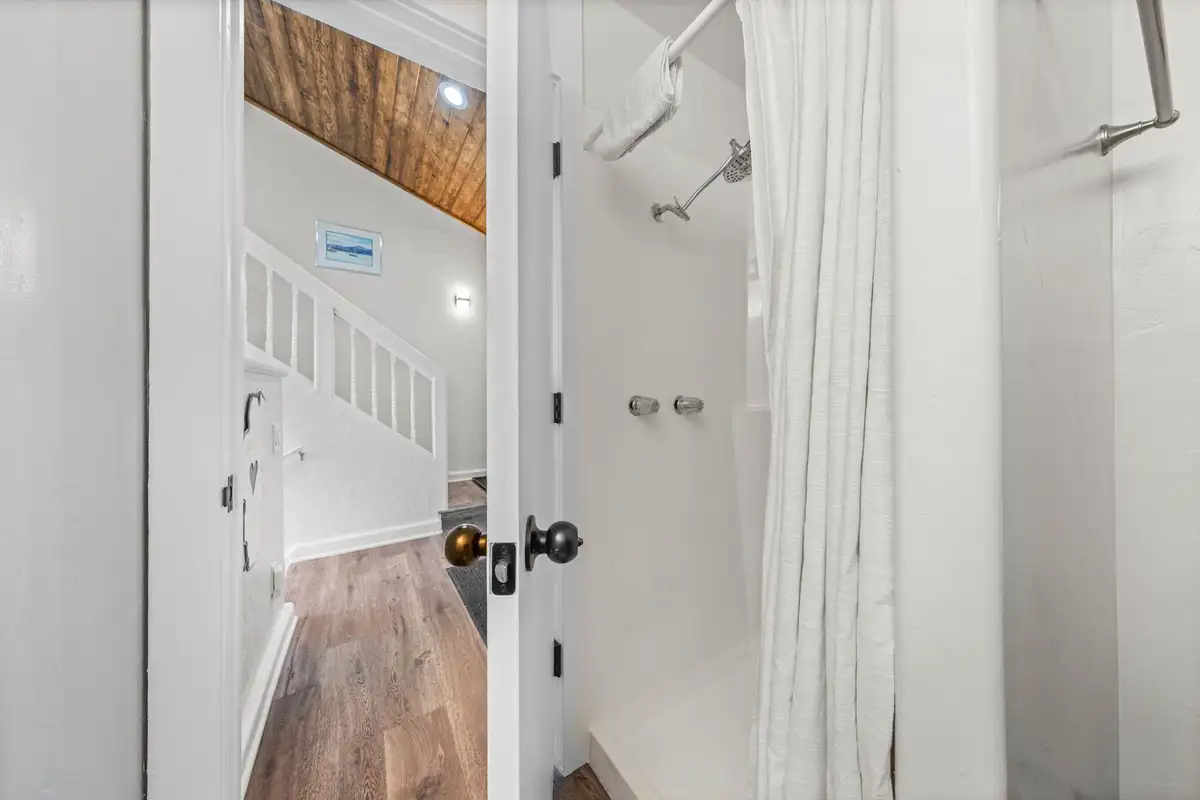Bathroom with a shower curtain and wood flooring, Lakeview Haven in Incline Village