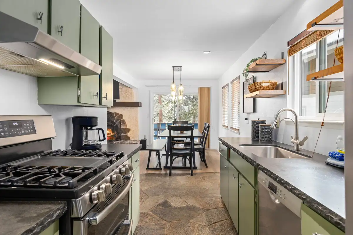 Kitchen with gas range and dining table beyond, Mountaintop Retreat