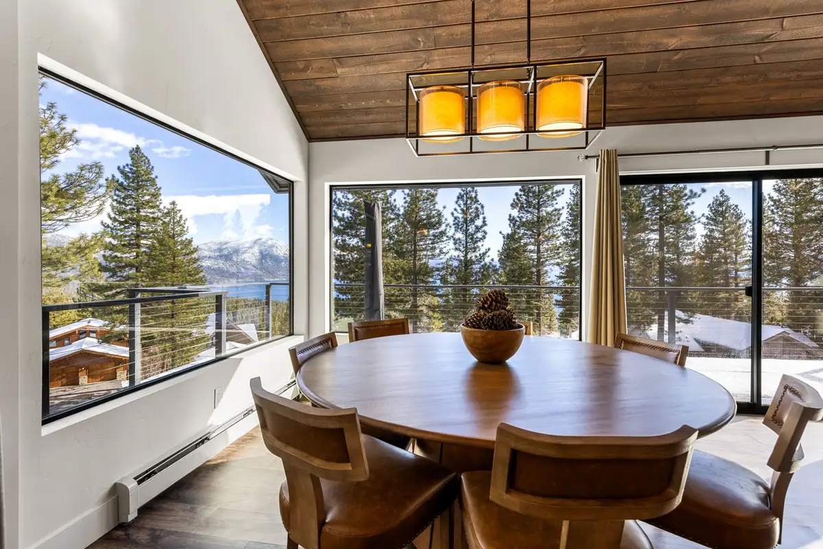 Round dining table by windows with Lake Tahoe visible, Incline Lakehouse Lookout