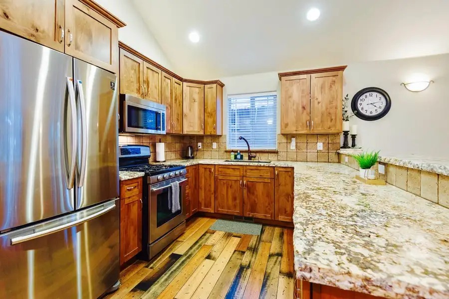 Kitchen with granite counters and stainless appliances, Trout and About
