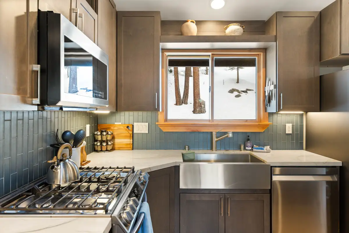 Kitchen with gas range, farmhouse sink and tiled backsplash, Sugar Pine Tahoe Lodge