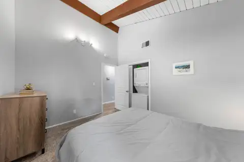 Bedroom with a bed and beamed ceiling, Incline Tranquil Loft