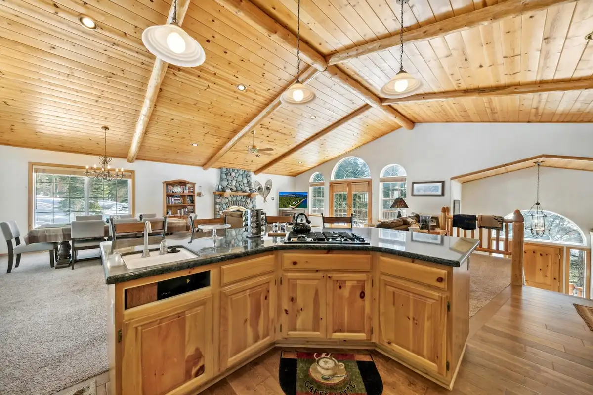 Kitchen island overlooking the open dining and living areas, Hastings Hideaway Cabin