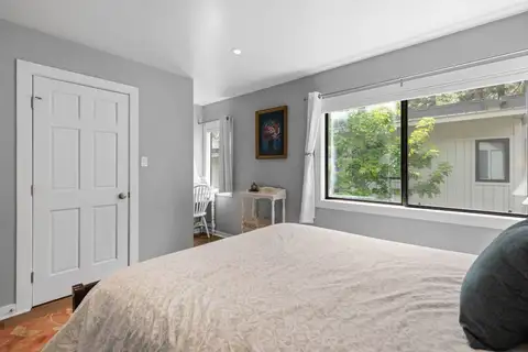 Bedroom with a bed and large window, Tahoe Peaks & Shores Retreat