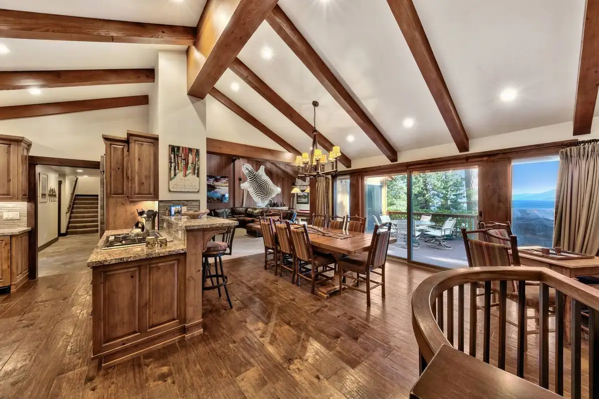 Open dining and kitchen area with beamed ceiling and lake view, Mammoth Haven Retreat