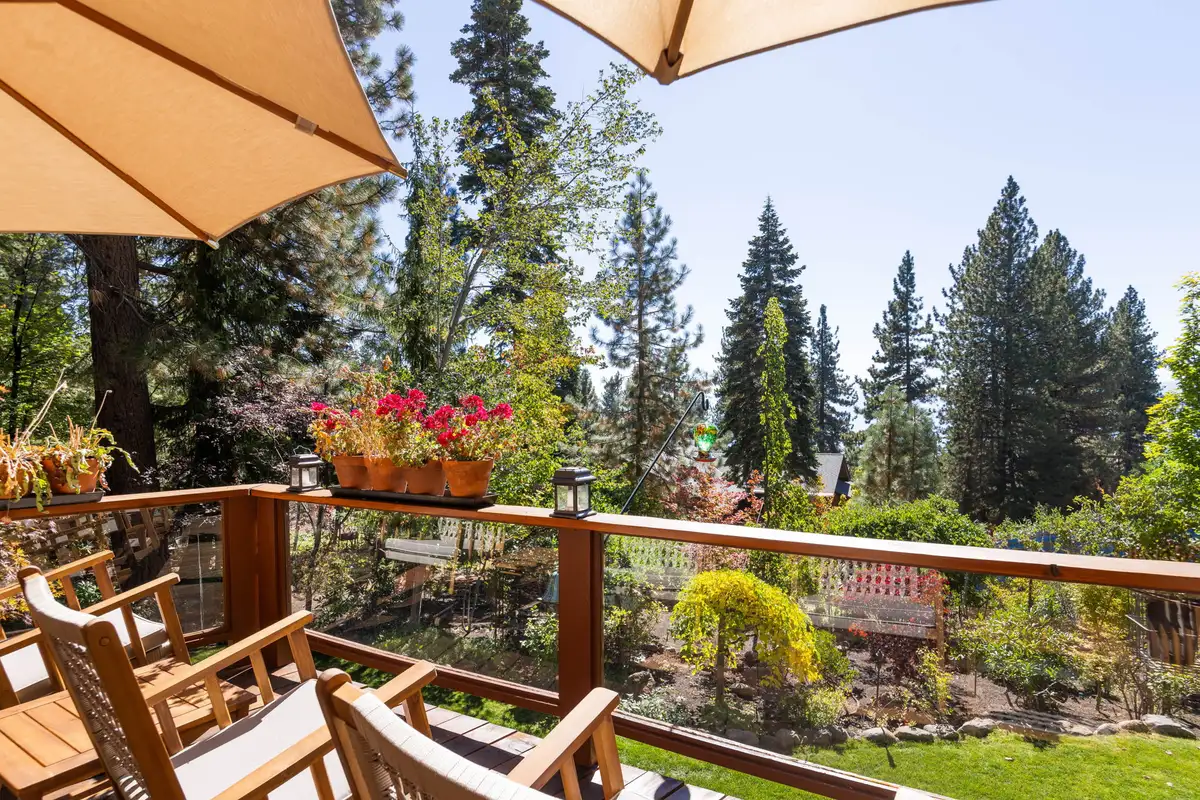 Deck with chairs and flower boxes overlooking a garden, Incline Lakeside Haven