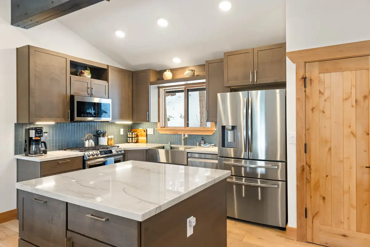 Kitchen with marble island and stainless appliances, Sugar Pine Tahoe Lodge